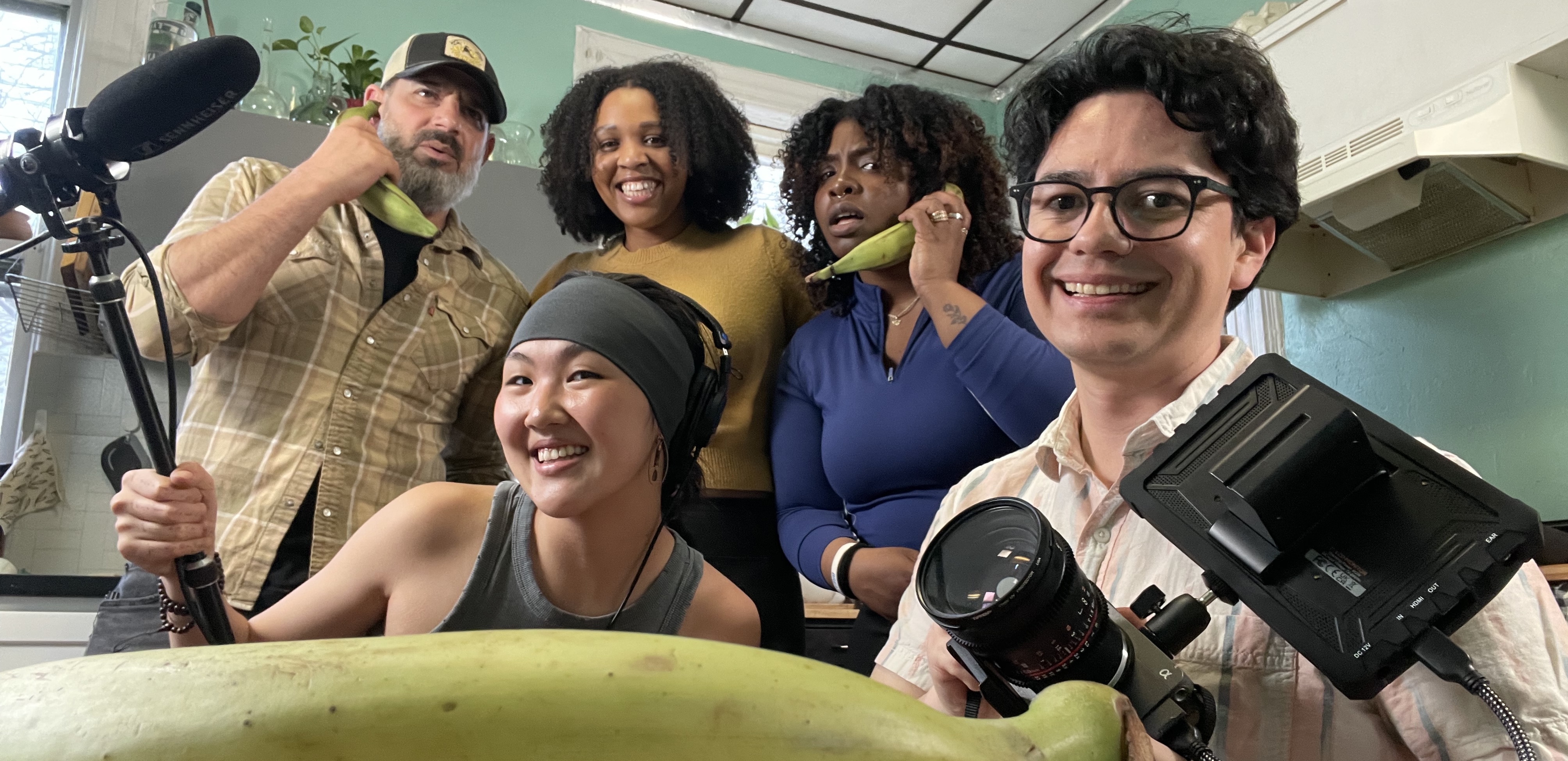 Production crew on set with camera and sound equipment