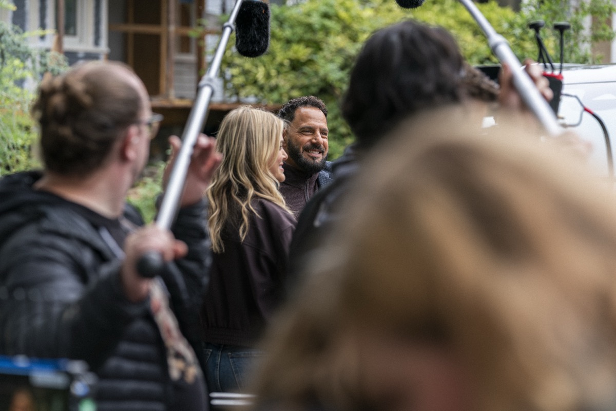 Patrick Sabongui laughing on set with cast and crew